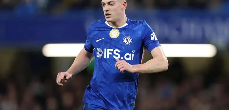 Player running in blue Chelsea kit during match