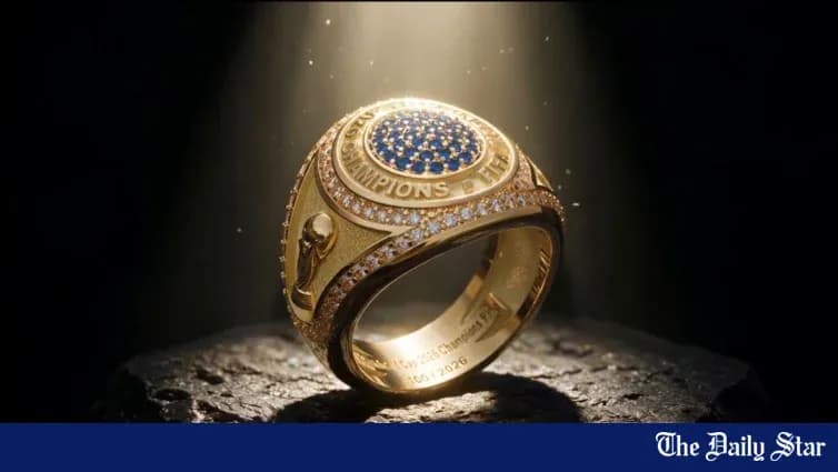 Golden championship ring on a stone pedestal