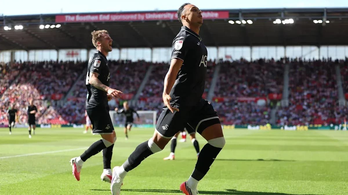 Swansea City players celebrating a goal during match