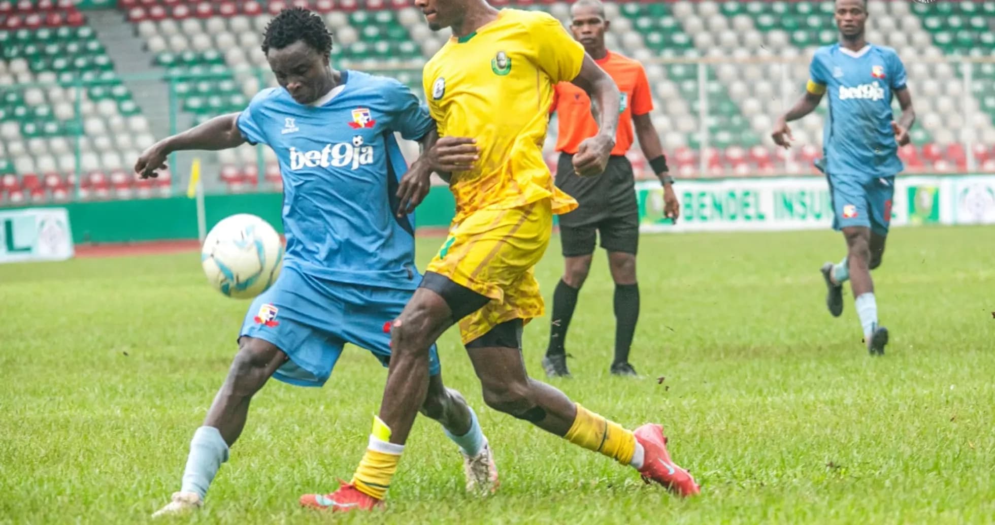 Players contesting for the ball during match