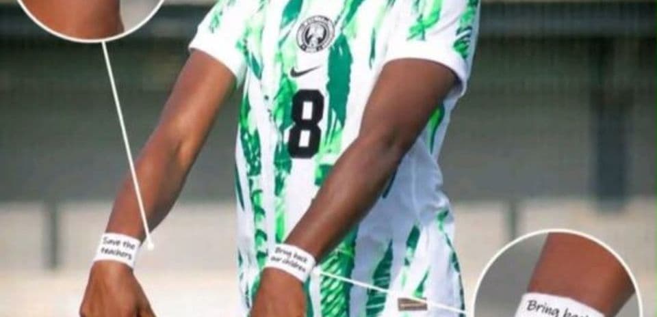 Player in Nigeria jersey showcasing protest wristbands