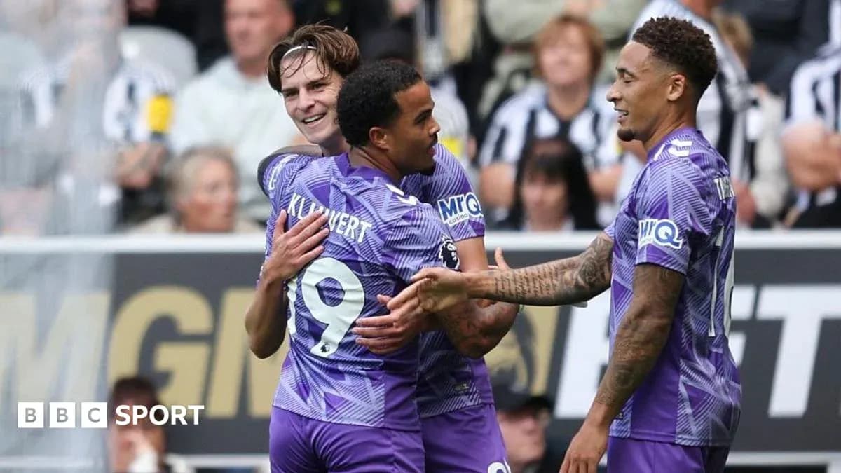 Players celebrating a goal on the field