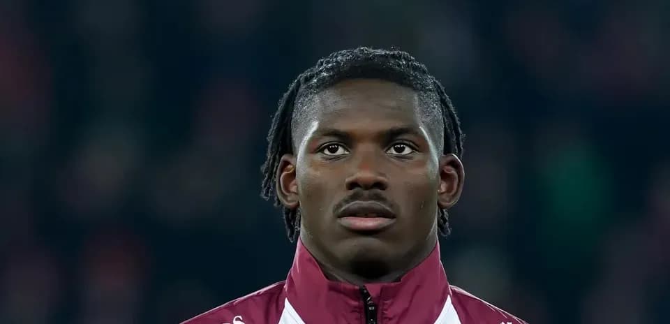 Player in warm-up jacket during match preparation