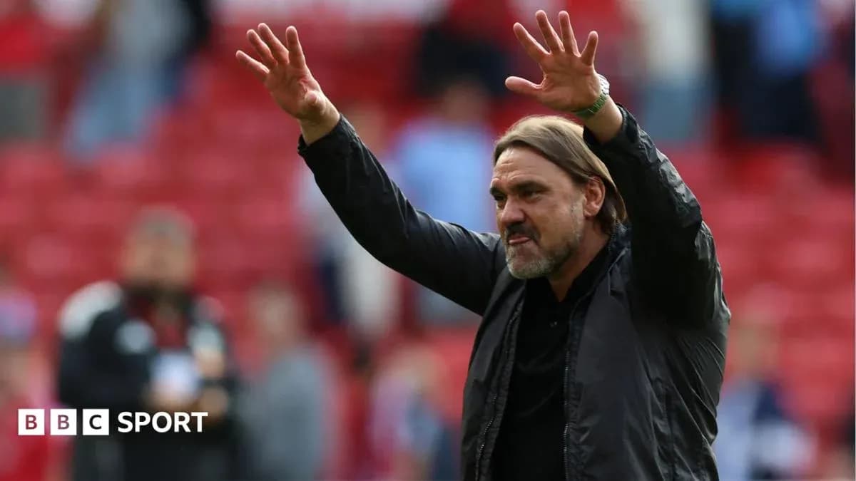 Coach gesturing to crowd during match celebration