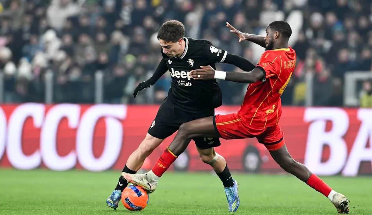 Player tackling opponent during Lecce vs Juventus match