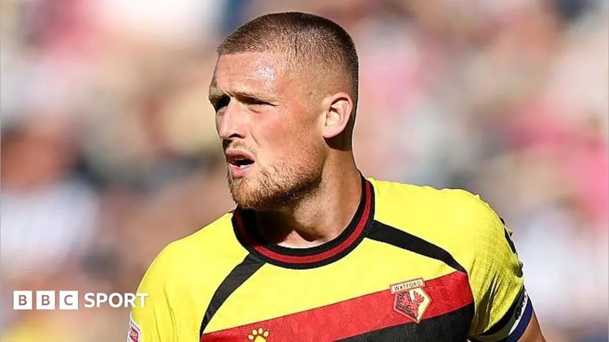 Player in Watford jersey during match action