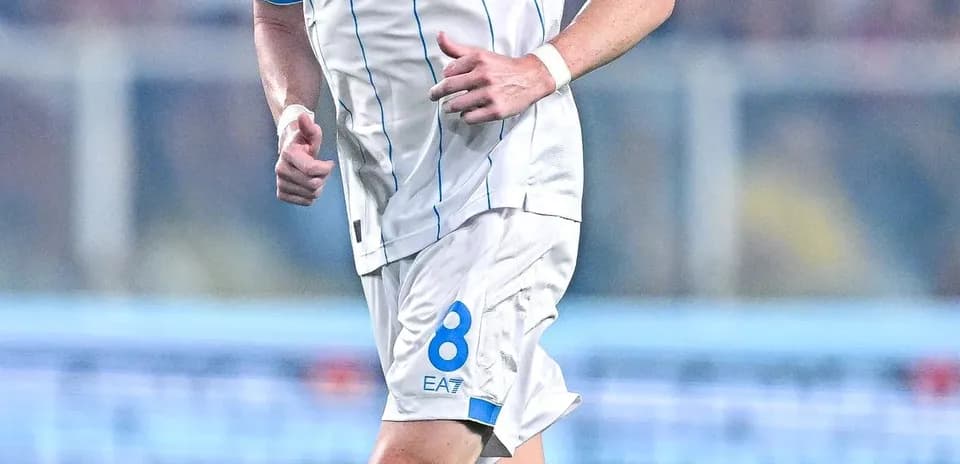 Player wearing Napoli jersey running on the field