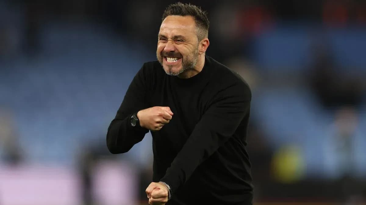 Coach celebrating enthusiastically on the sidelines