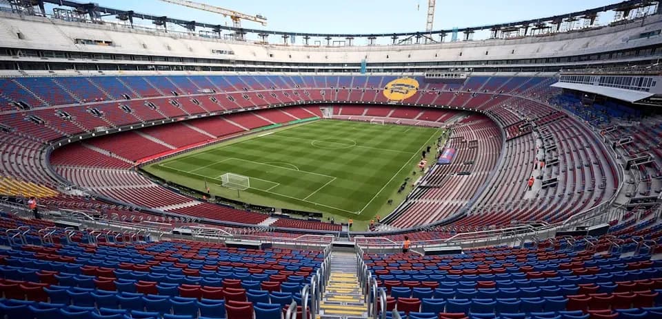 View of empty stadium with football pitch under construction