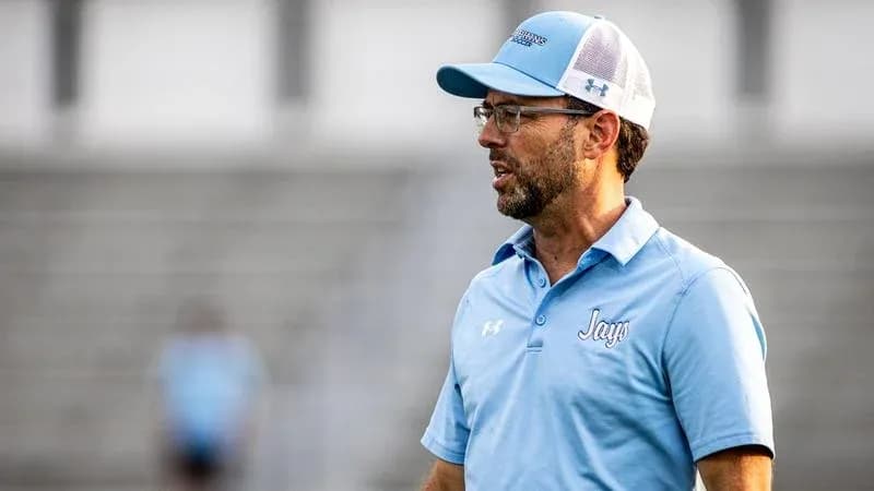 Coach speaking during practice session on field