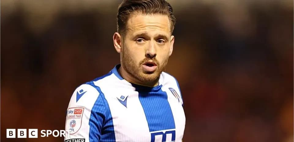Player in blue and white kit during match
