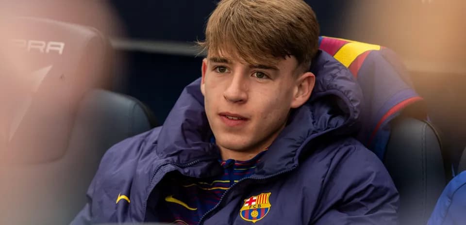 Young player seated on bench during match