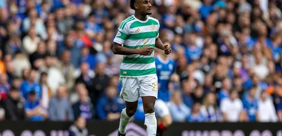 Celtic player running on pitch during match