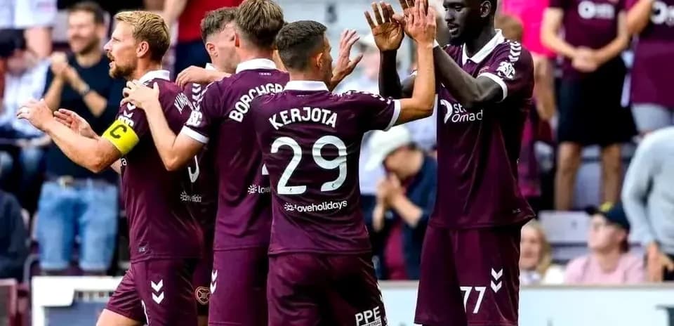 Hearts players celebrating a goal together