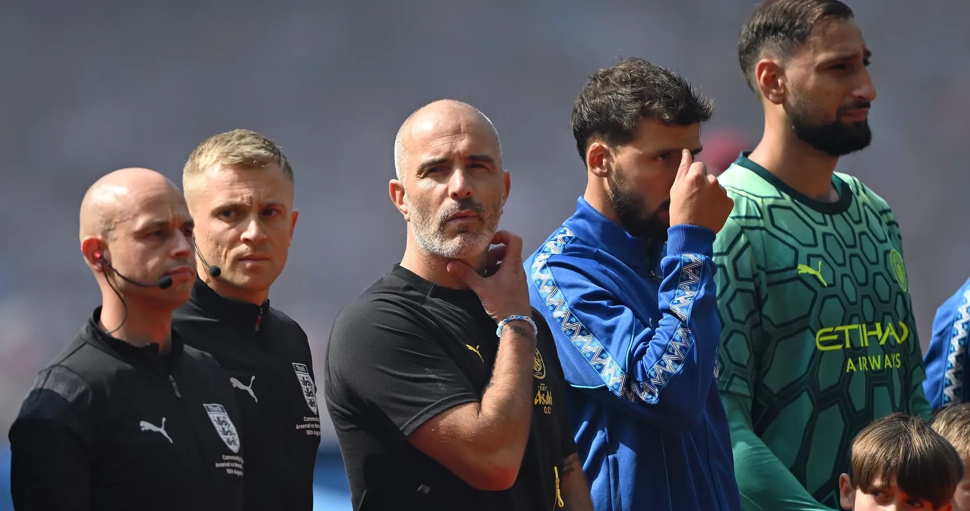Coaches and players standing during pre-match ceremony