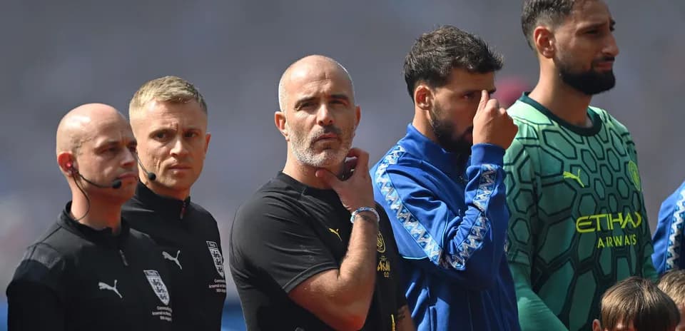 Coaches and players standing during pre-match ceremony