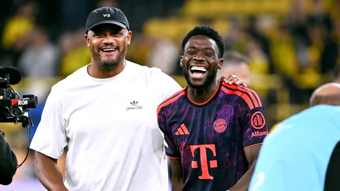 Two men laughing together on the field