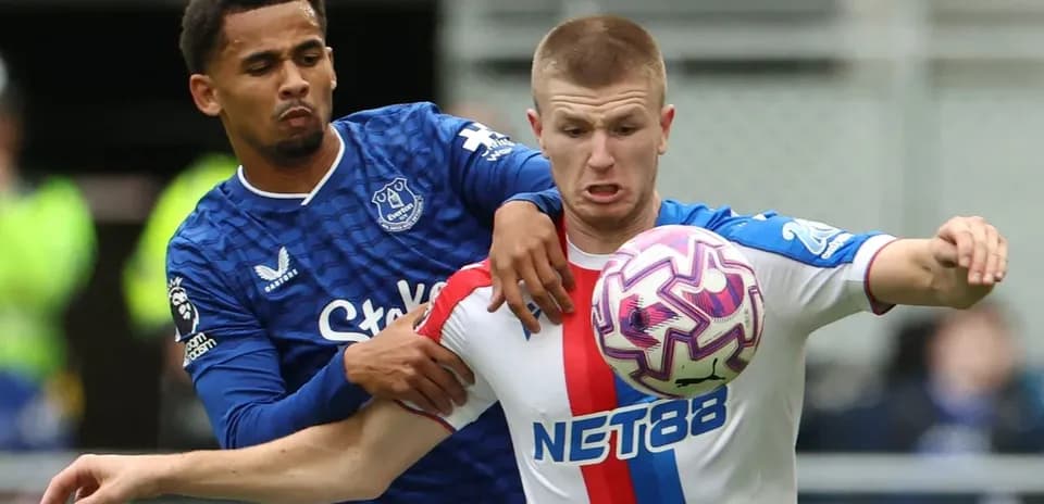 Two players competing for the ball during match