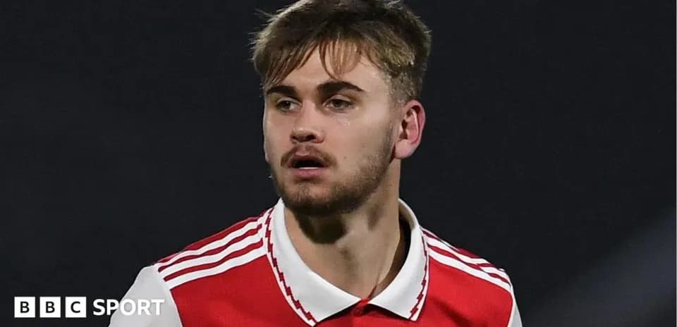 Player in red jersey during a match