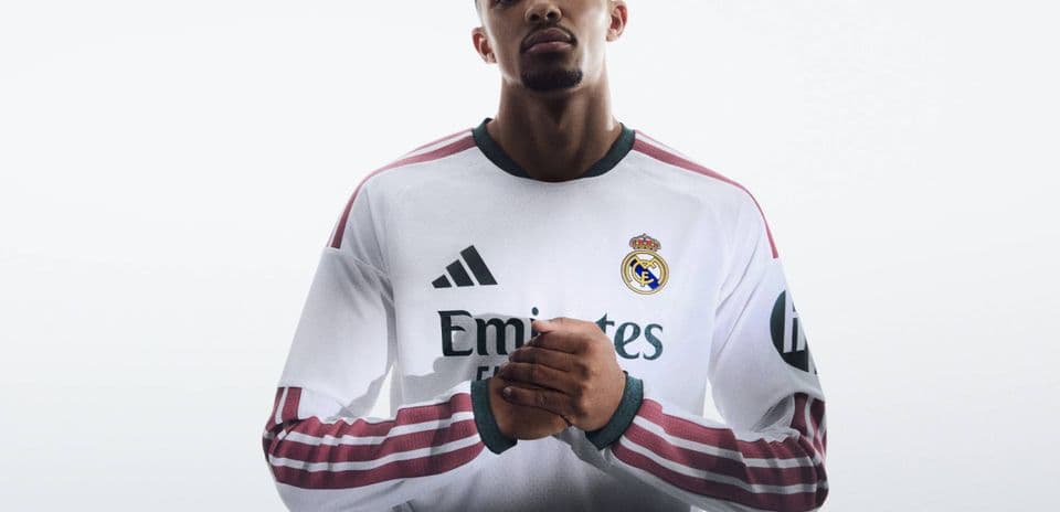 Player in Real Madrid jersey posing confidently