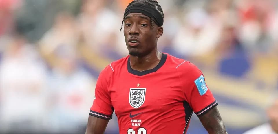 Player wearing red England jersey on the field
