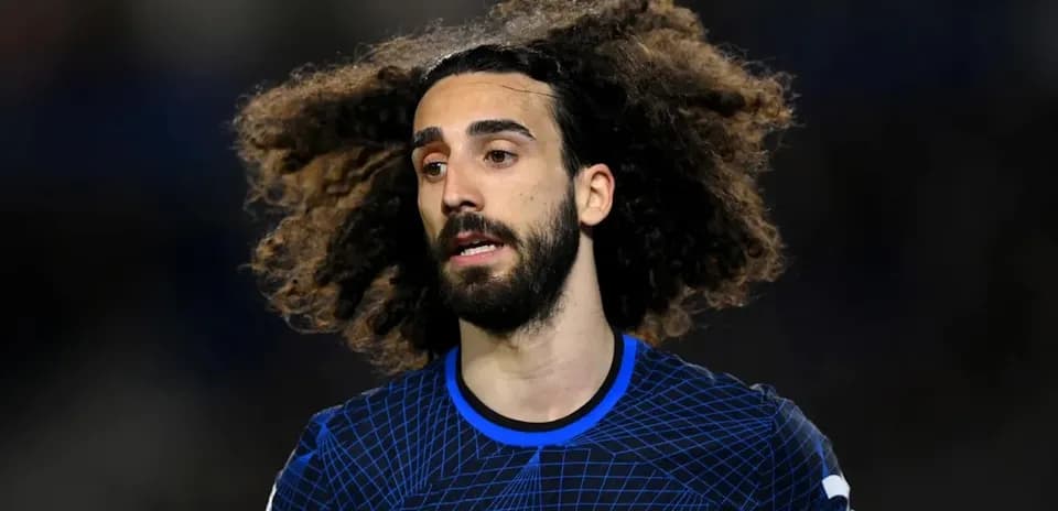 Player with curly hair in Chelsea jersey