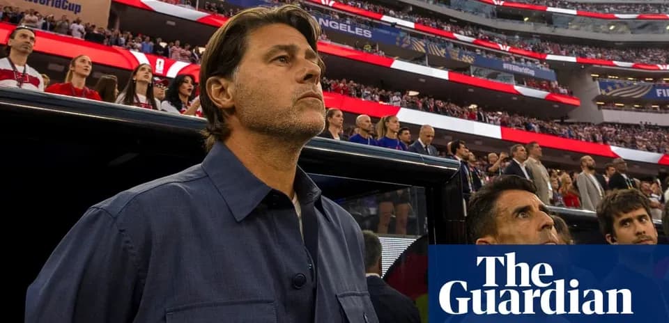 Coach observing players during national anthem at stadium