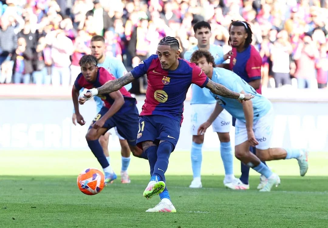 Barcelona player taking a penalty kick