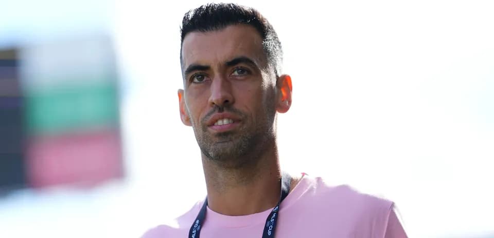 Player in pink shirt with MLS Cup lanyard