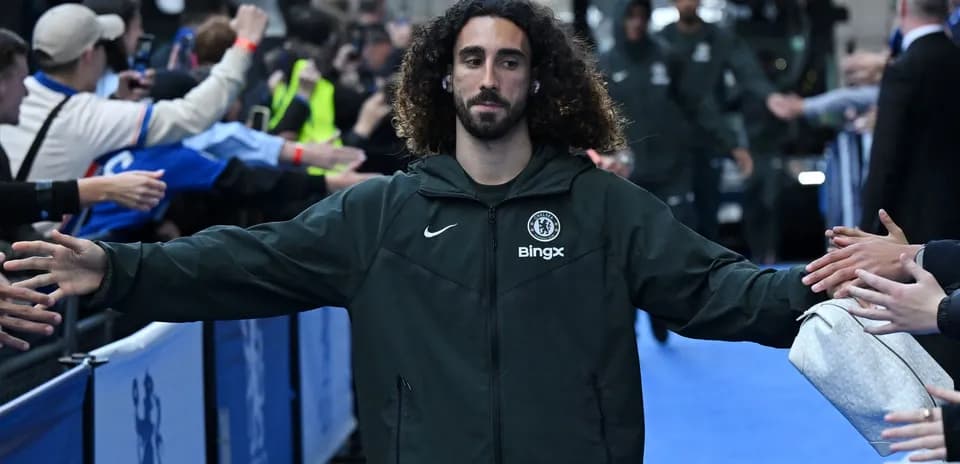 Player greeting fans while entering stadium