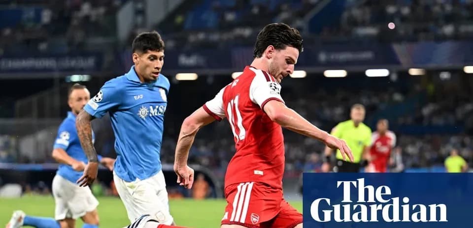 Player in red dribbling past defender in blue