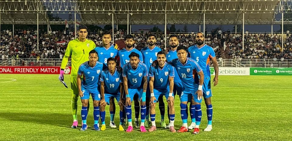 Football team posing for a group photo before match