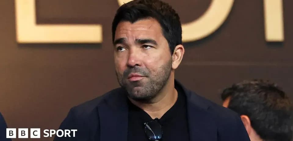 Man in a suit looking away at event