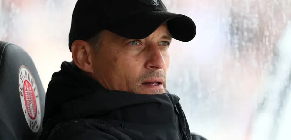 Coach observing from the sidelines during a match