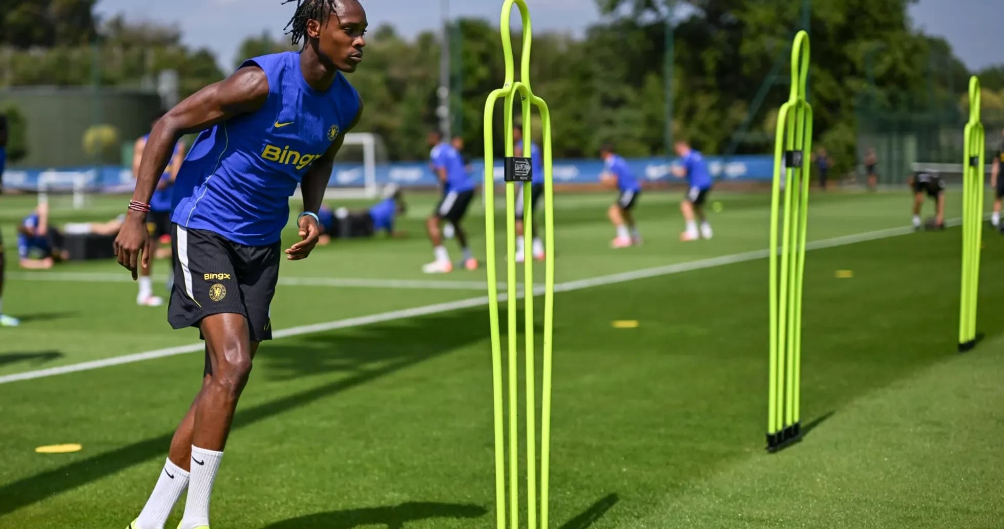 Player training with agility poles during practice session