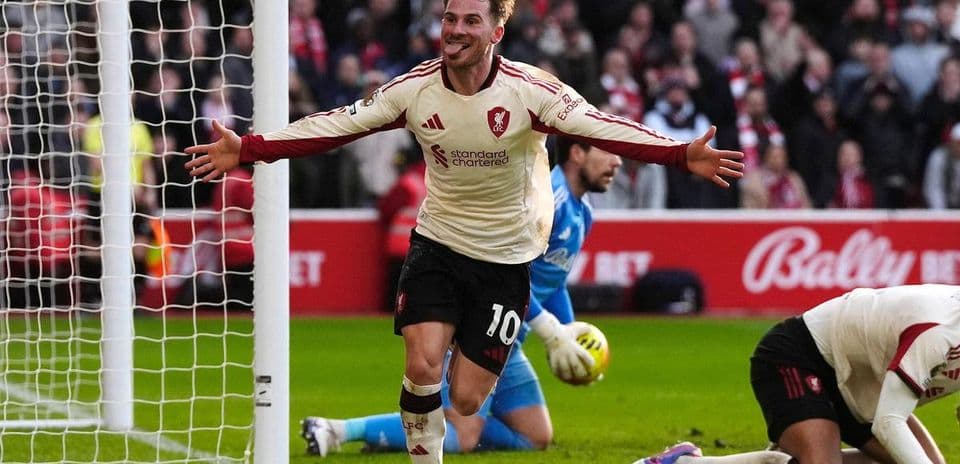 Liverpool player celebrating after scoring a goal