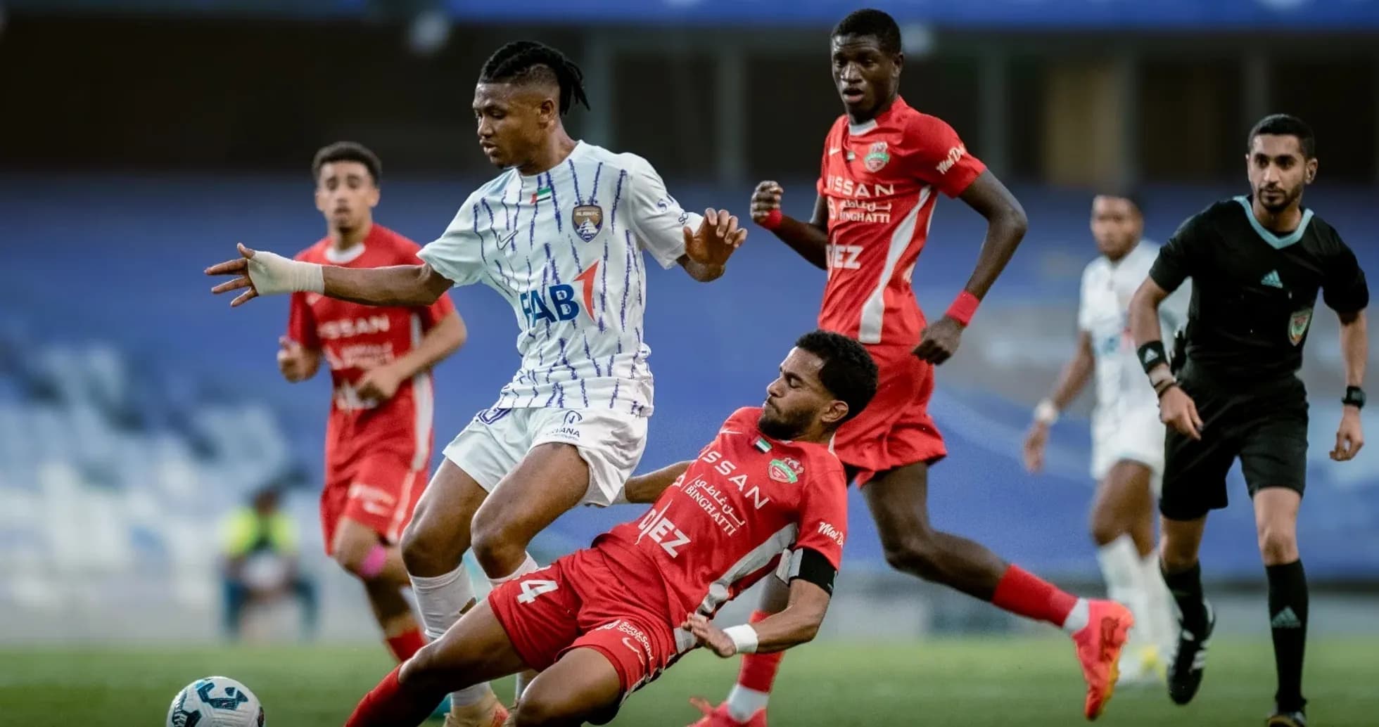 Al Ain U23 player evading tackle from Al Sharjah U23