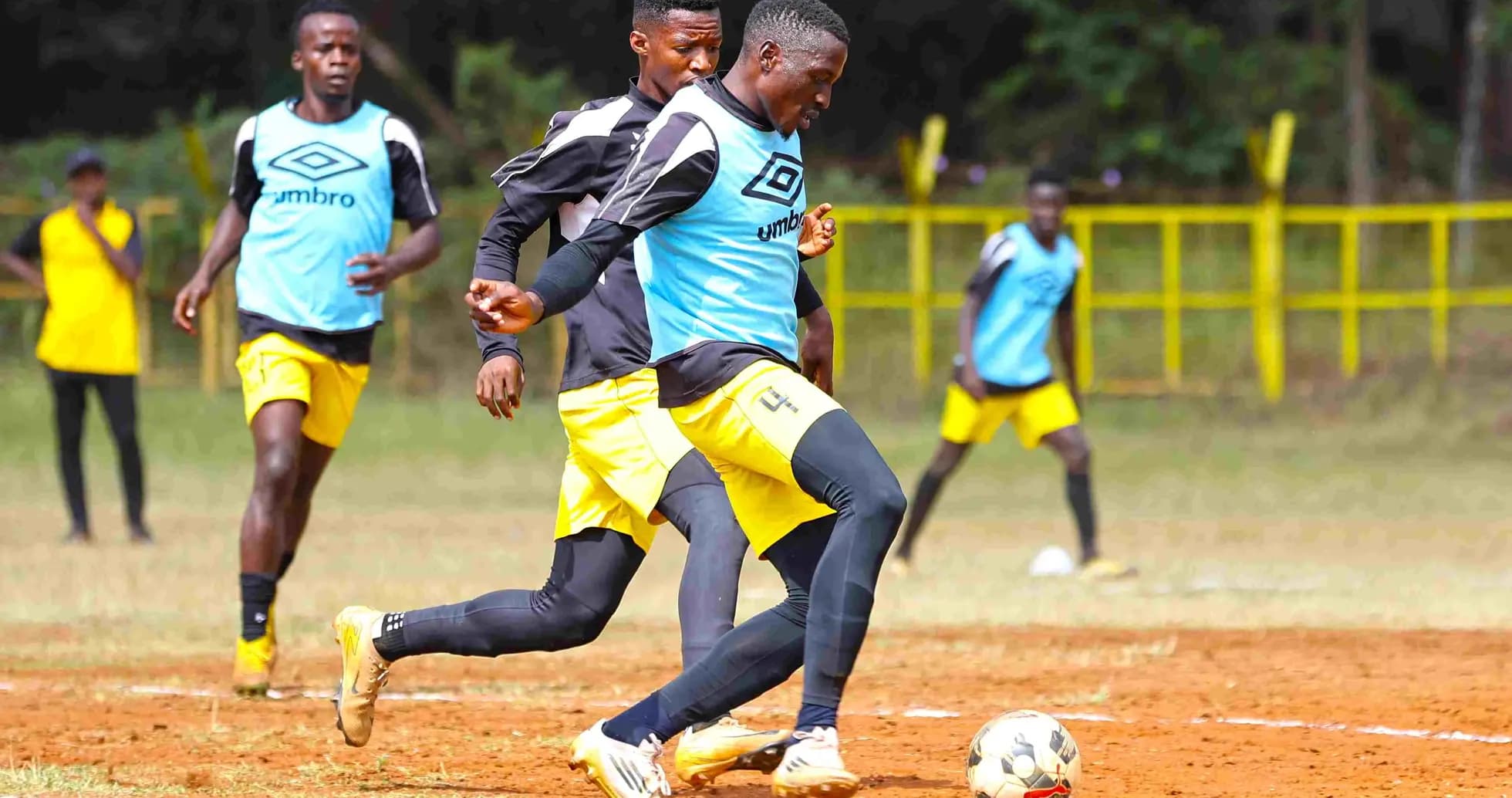 Players training on the field before match