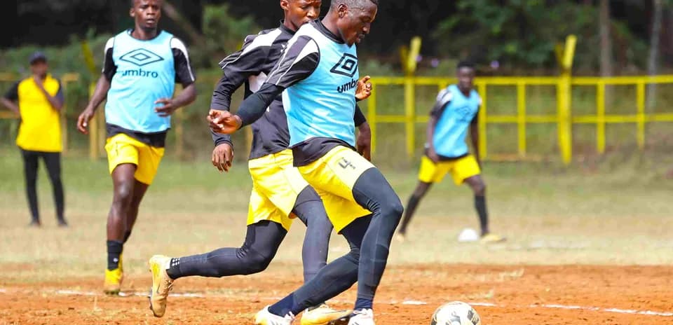 Players training on the field before match