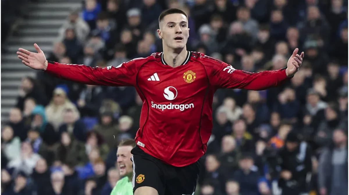 Player celebrating a goal in Manchester United jersey