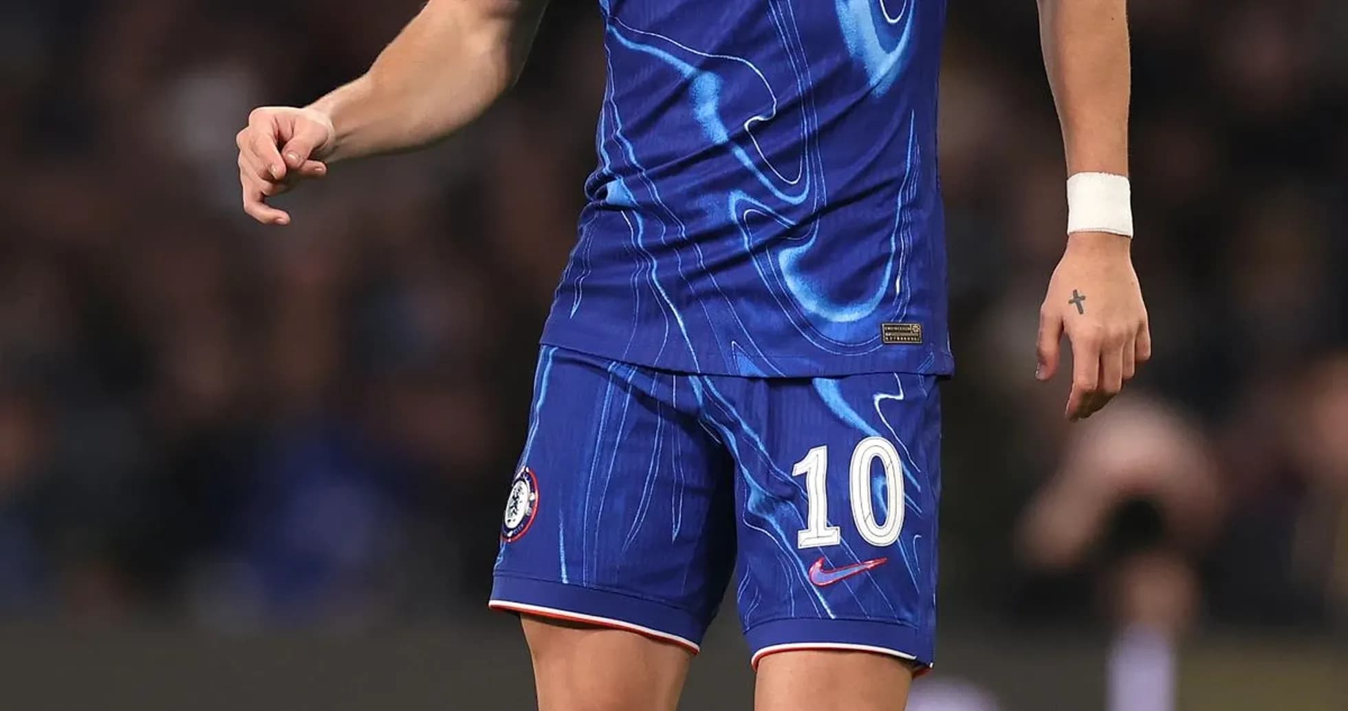 Player in blue Chelsea kit preparing to pass ball