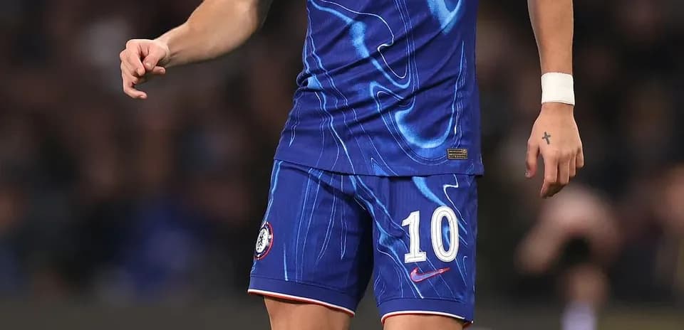 Player in blue Chelsea kit preparing to pass ball