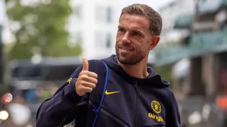 Player giving thumbs up outside stadium