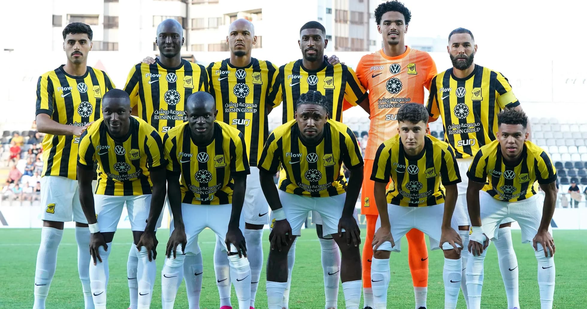 Football team posing for a group photo in uniforms