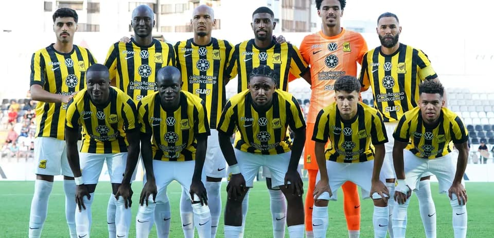 Football team posing for a group photo in uniforms