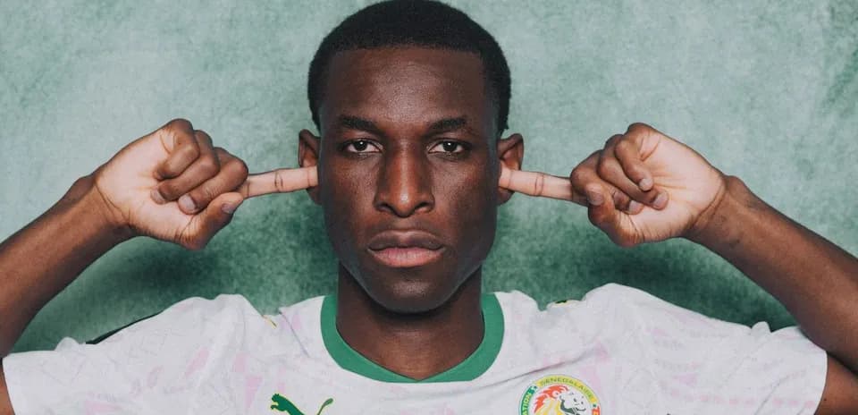 Football player with hands over ears in jersey