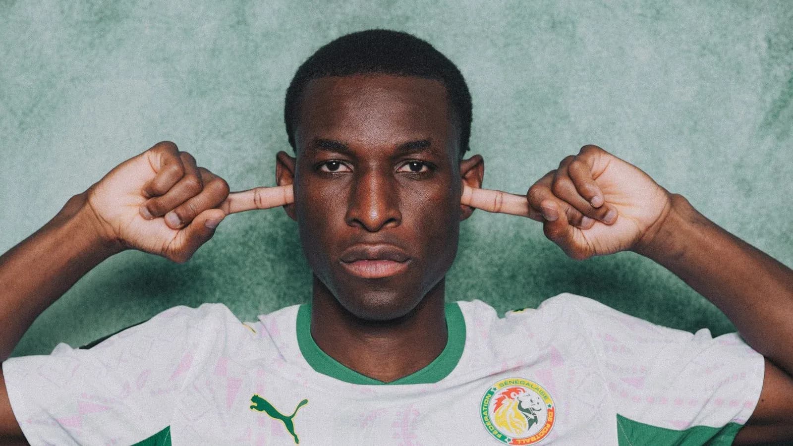 Football player with hands over ears in jersey