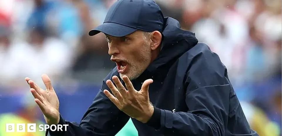 Coach gesturing during a football match on sidelines