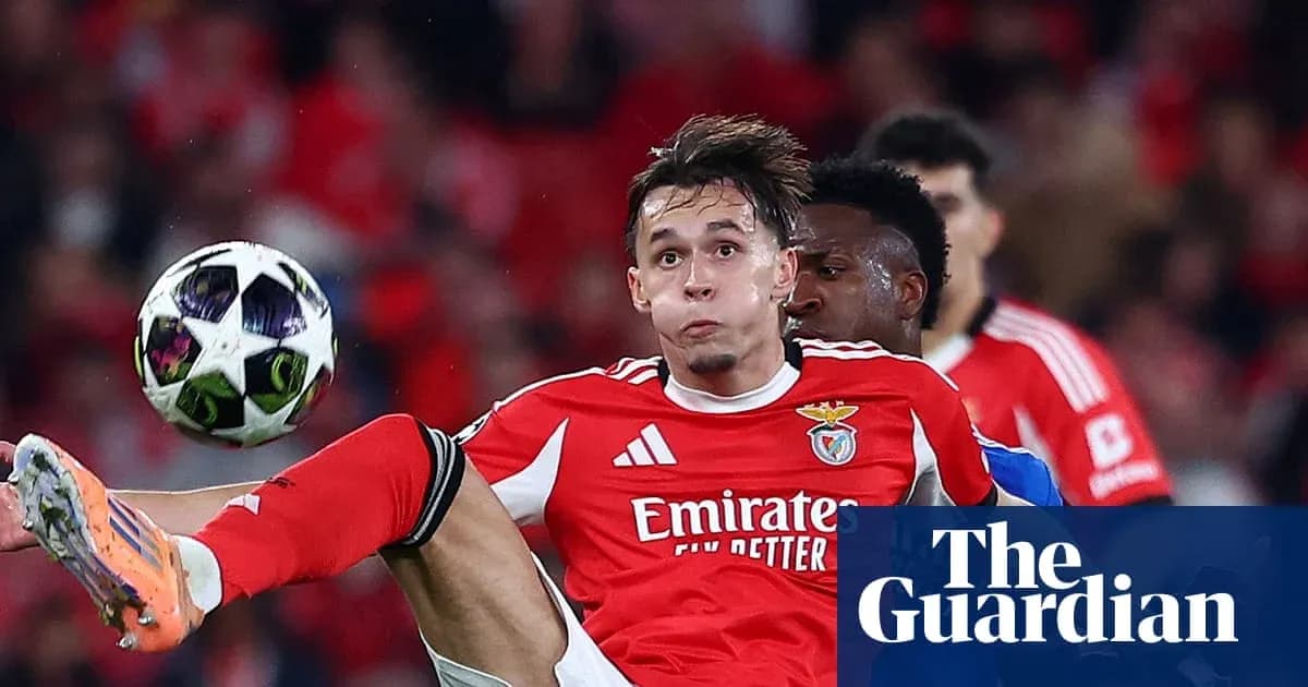 Benfica player attempting to control ball during match