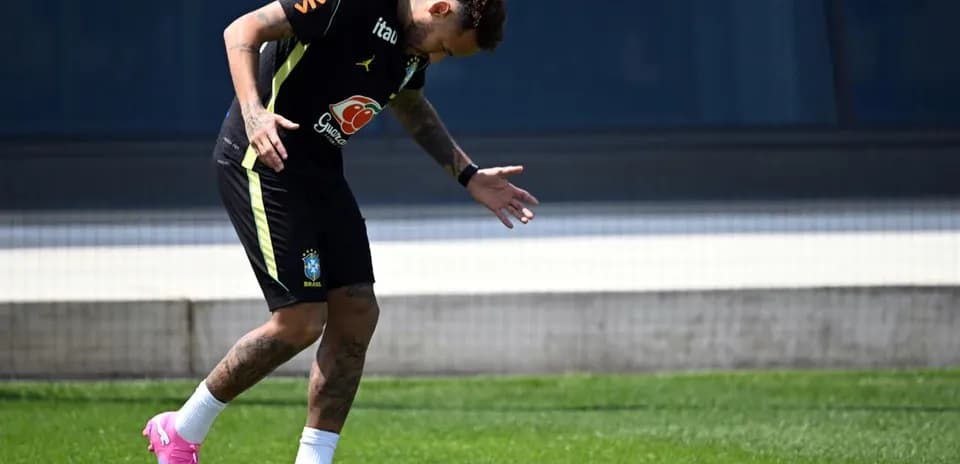 Player training on the field in Brazil kit